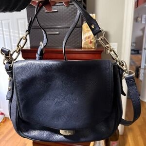 Women’s blue Kate spade crossbody bag